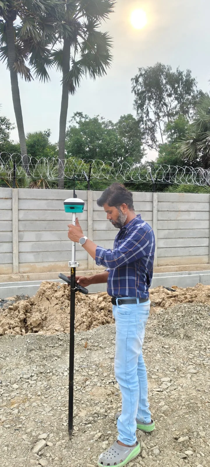 Land surveyor taking a field measurement